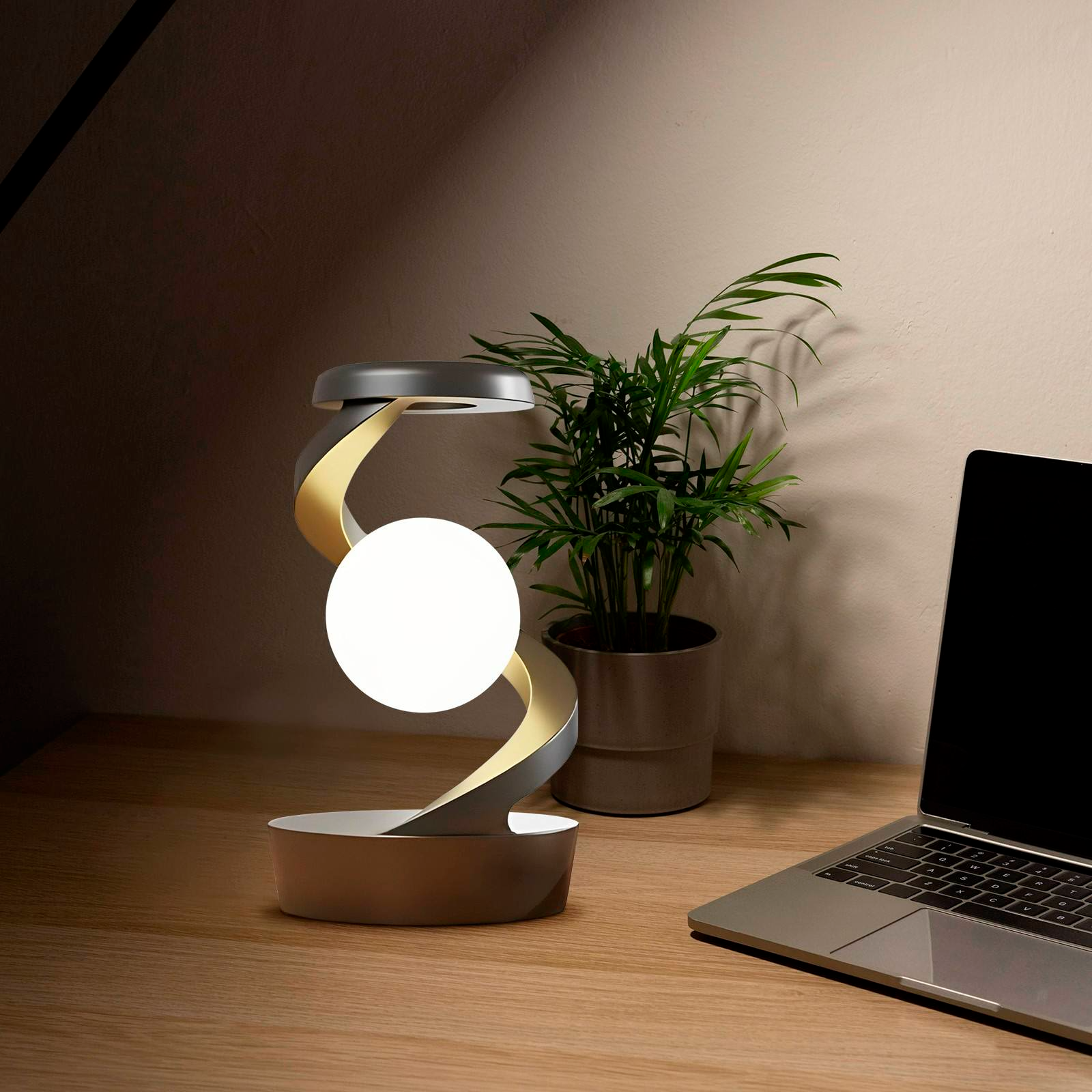 The Orbivolt™ Rotating Wireless Charging Lamp